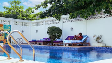 Outdoor pool, pool umbrellas, pool loungers