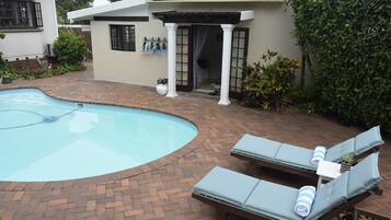 Outdoor pool, open 7:00 AM to 6:30 PM, pool umbrellas, pool loungers
