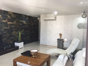 Deluxe Apartment, 2 Bedrooms, City View | Living room | 52-inch Smart TV with satellite channels, TV