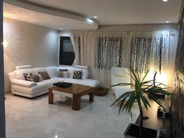 Deluxe Apartment, 2 Bedrooms, City View | Living room | 52-inch Smart TV with satellite channels, TV