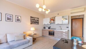 Living area - A breathtaking view in an enchanting place on LAKE COMO: apartment with 2 large bedrooms, an ideal solution for 2 couples or a family of 4. The apartment is located on the hills of Bellano, near an old sawmill. Free parking spaces are available right in  (Bellano)
