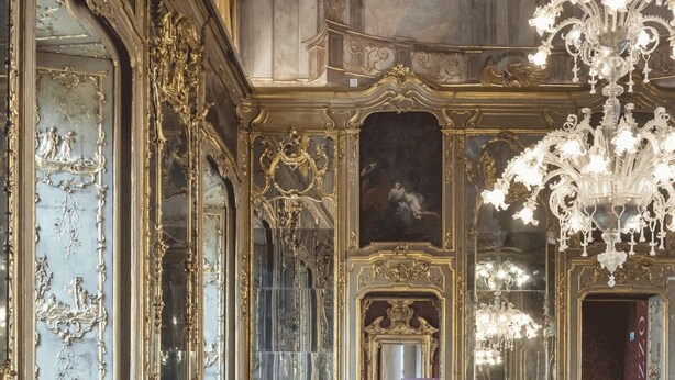 An ornate room with elaborate gold detailing, a large chandelier, and a patterned floor. - Milano Charming apartment, a unique home: central area, 2BDR, 2BTH, 4 Guests (Milano)