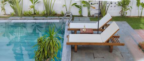 Outdoor pool, open 8:00 AM to 8:00 PM, pool umbrellas, pool loungers