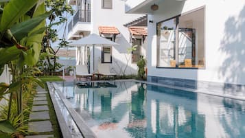 Outdoor pool, open 8:00 AM to 8:00 PM, pool umbrellas, pool loungers