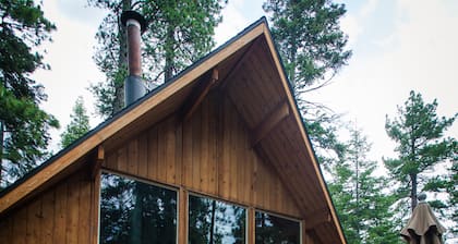 A super cabin on Tahoe's West Shore with PRIVATE BEACH RIGHTS. Up against forest