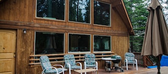 A super cabin on Tahoe's West Shore with PRIVATE BEACH RIGHTS. Up against forest