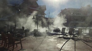 A patio area with outdoor seating and a steam feature. - Breckenridge Christmas & New Year weeks 2021-2022 email (Breckenridge)