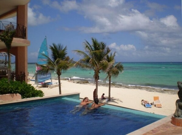 On the beach, sun-loungers, beach towels