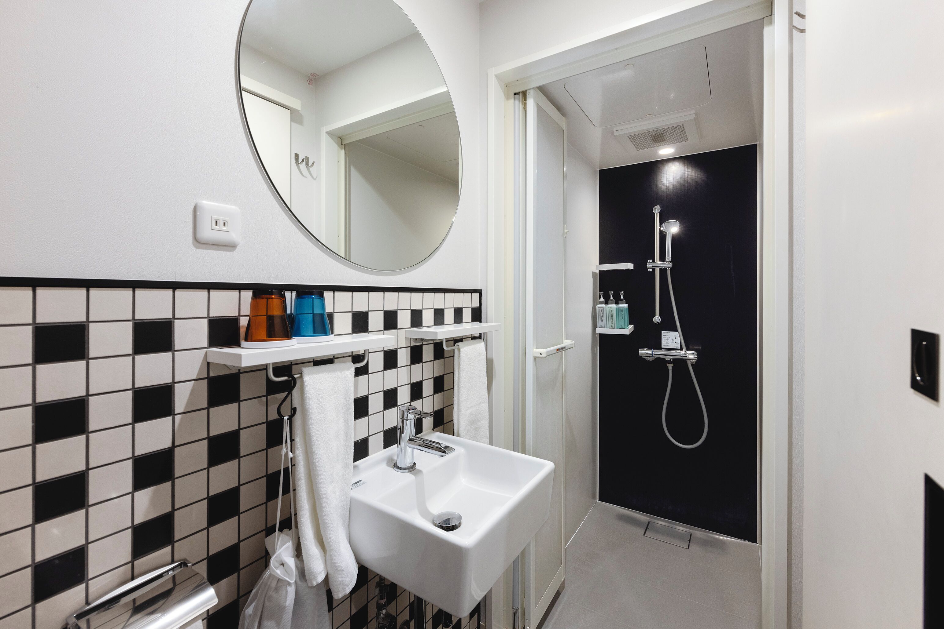 shower, hair dryer, bathrobes, slippers