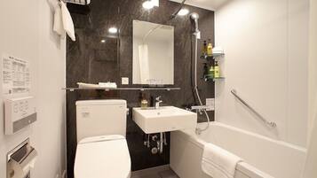 Combined shower/tub, free toiletries, hair dryer, slippers
