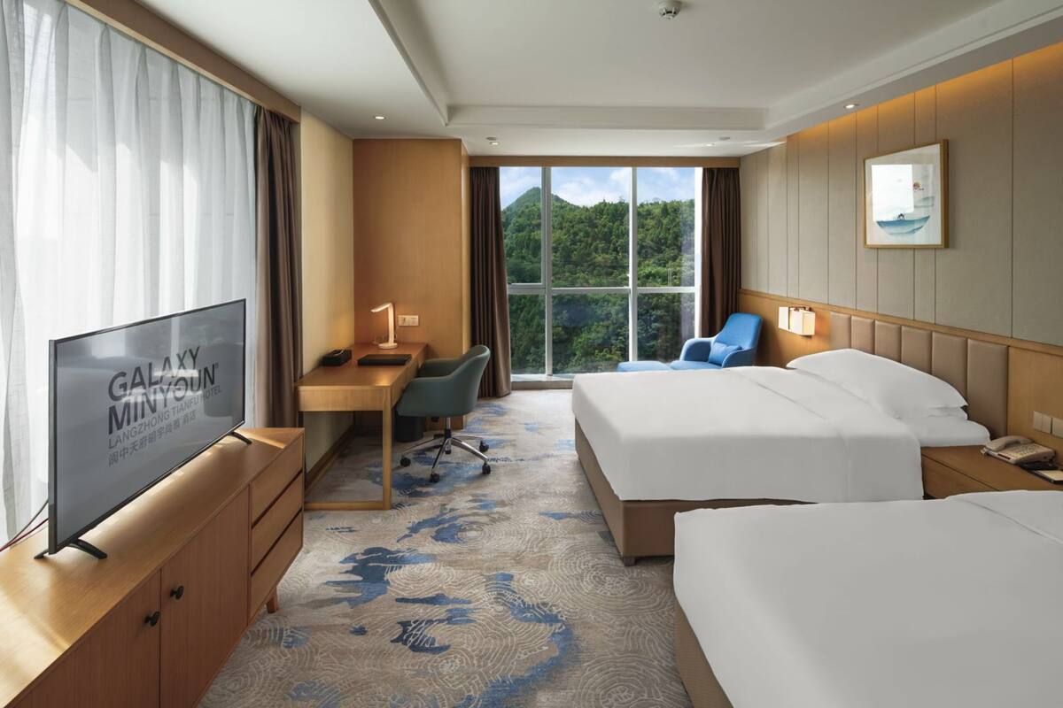 Discovery Room, Garden View | Minibar, in-room safe, desk, blackout curtains