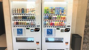 Two vending machines stocked with beverages and snacks. - Toyoko Inn Urawa Misono Station (Saitama)