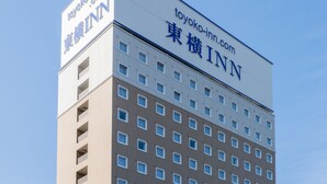 A multi-story building with a sign reading "toyoko-inn.com" and "TOYOKO INN" in both English and Japanese. - Toyoko Inn Shizuoka Shimizu Ekimae (Shizuoka)