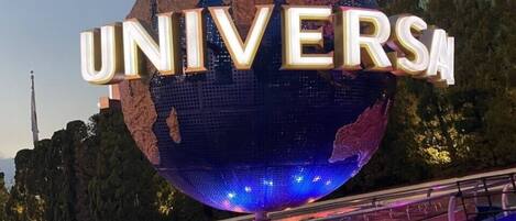 A large illuminated globe with the word "UNIVERSAL" on it.