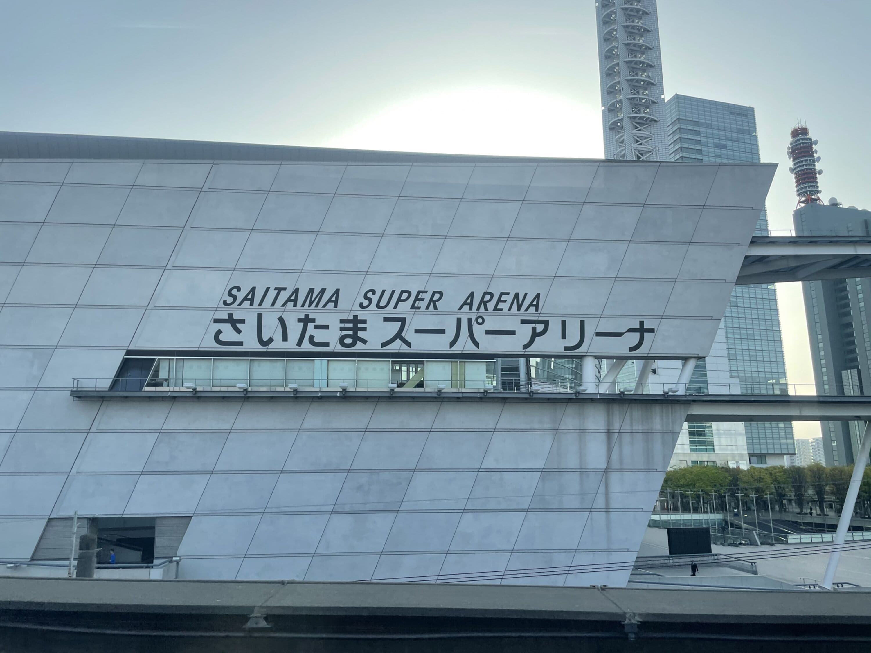The exterior of the Saitama Super Arena with a modern architectural design.