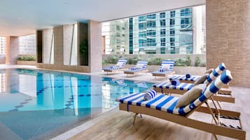 Indoor pool, open 6:00 AM to 10:00 PM, pool loungers