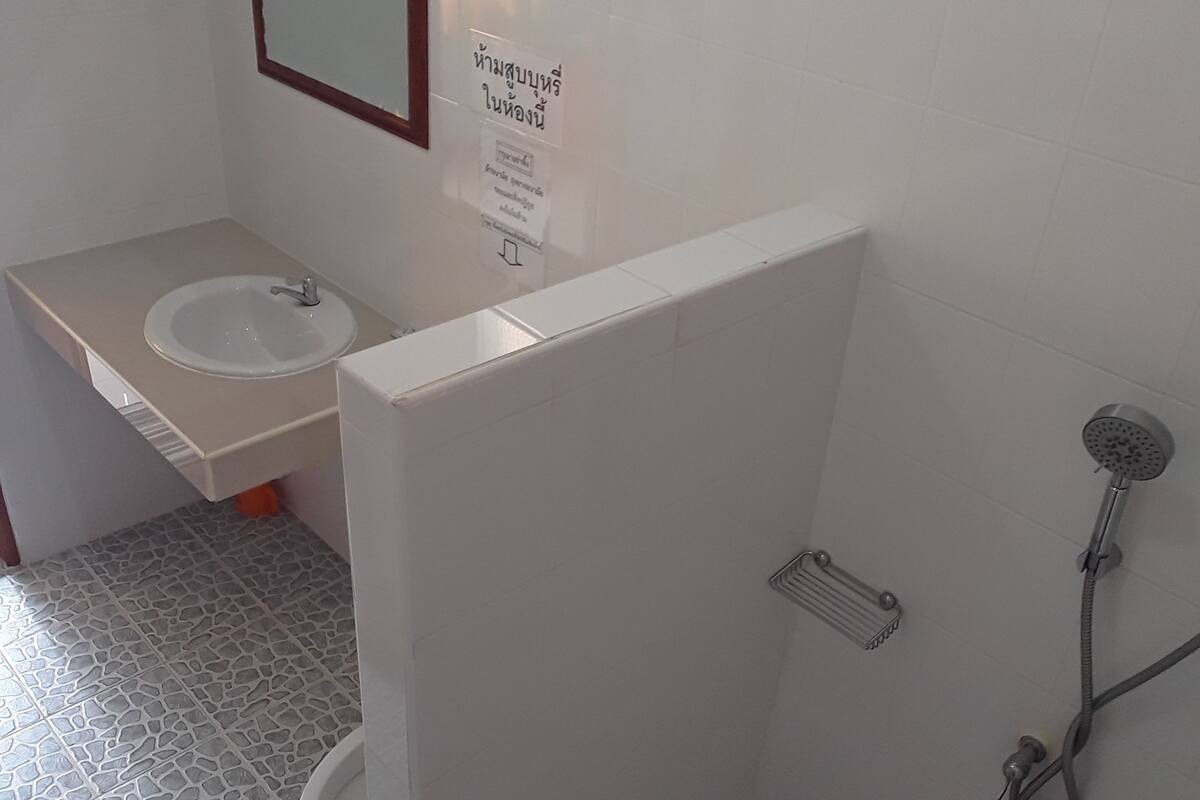 family single room | bathroom | shower, free toiletries, hair dryer, towels