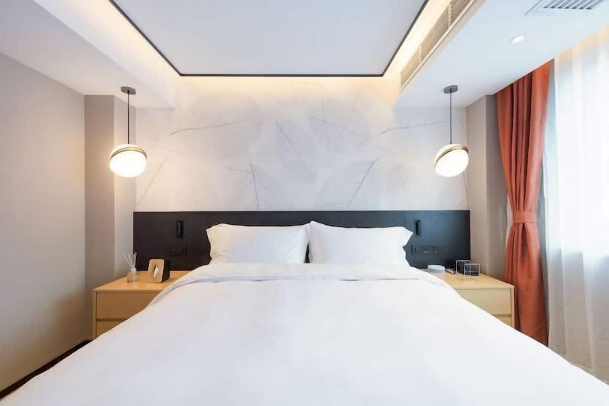 Premium bedding, down duvets, memory-foam beds, in-room safe