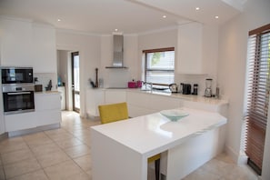 Deluxe House, Multiple Beds | Private kitchen