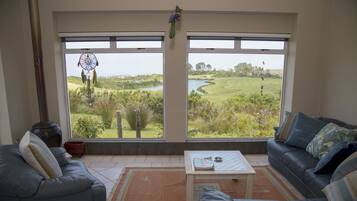 Comfort House | Living room | TV, fireplace