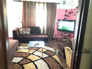 42-inch LED TV with satellite channels, TV, DVD player - Ronna apartments at Lakeside Estates (Madina)