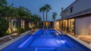Seasonal outdoor pool, open 8:00 AM to 10:00 PM, pool umbrellas
