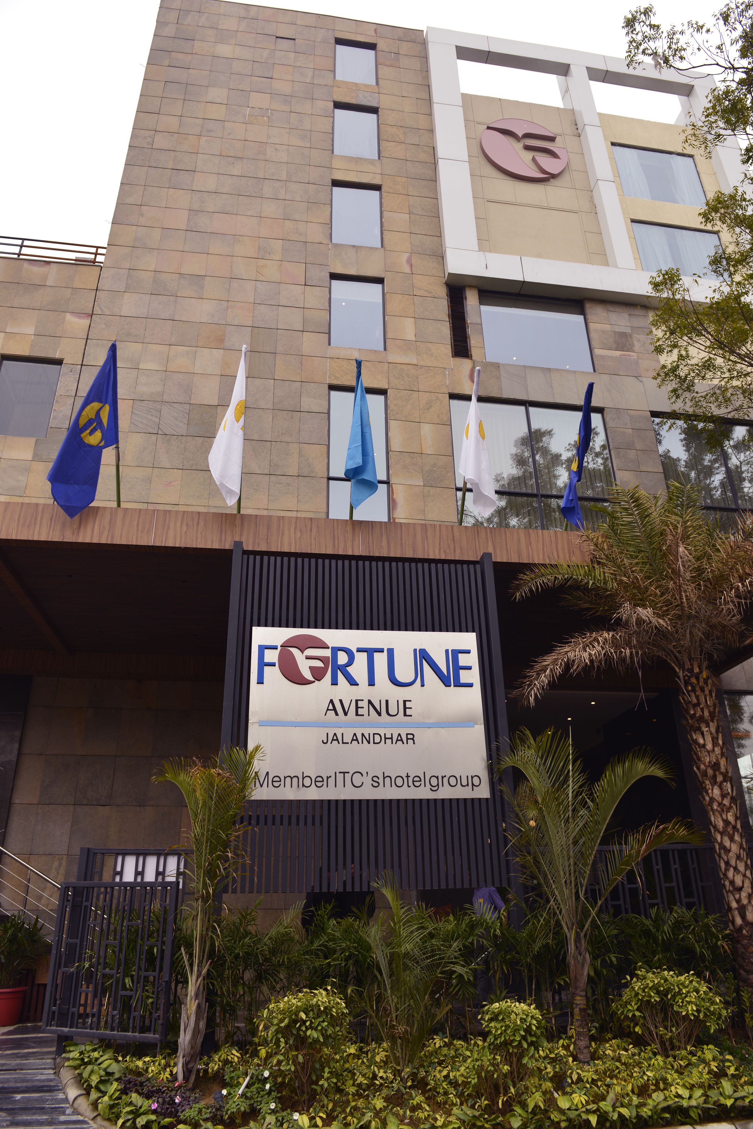 A building with a sign reading "FORTUNE AVENUE JALANDHAR MemberITC's hotelgroup".
