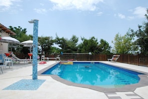 Seasonal outdoor pool, pool umbrellas, pool loungers