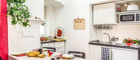 Apartment, 1 Bedroom | Private kitchen | Full-size fridge, microwave, stovetop, coffee/tea maker