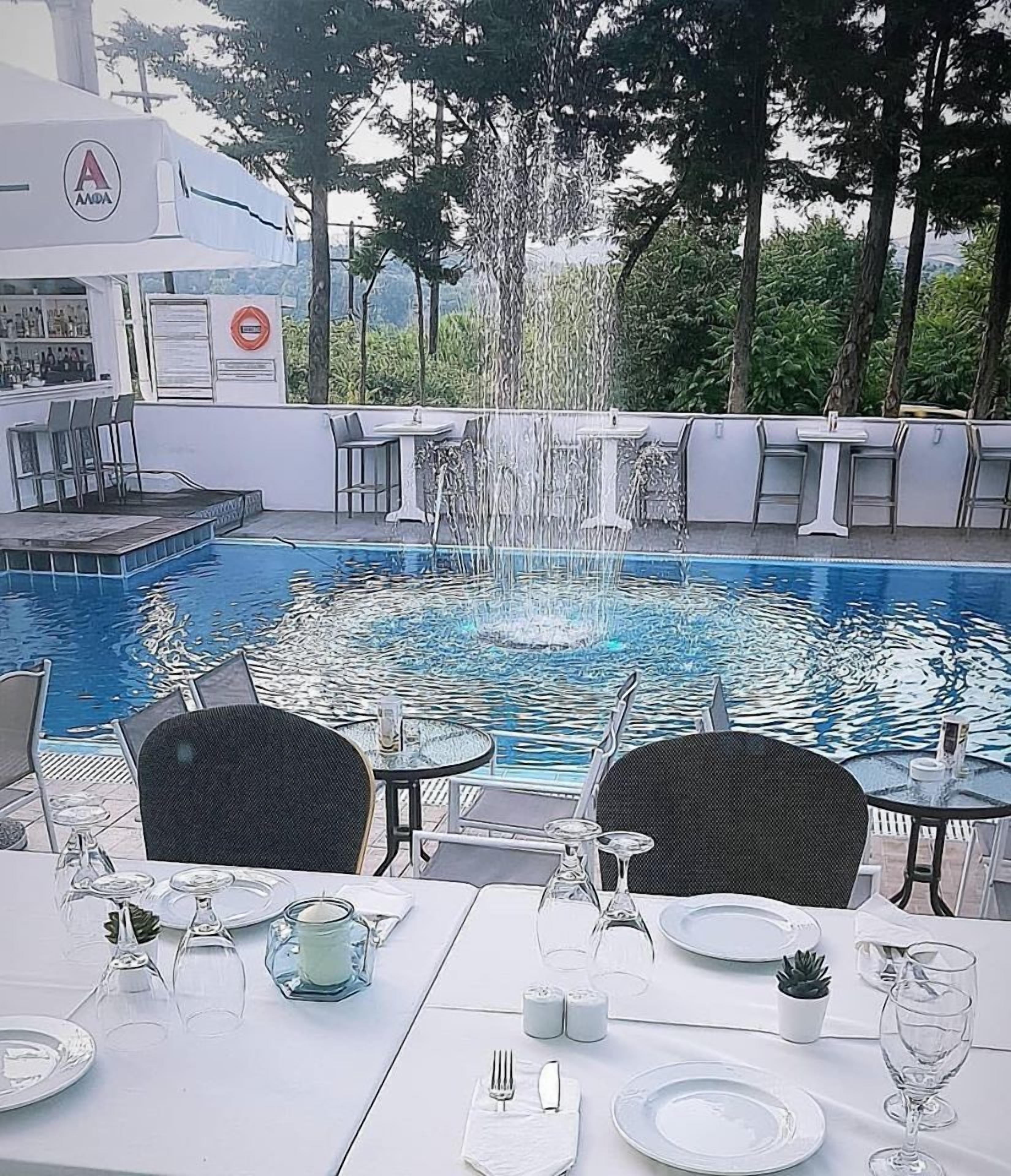 seasonal outdoor pool, open 9:00 am to 7:00 pm, pool umbrellas