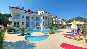 Outdoor pool, pool umbrellas, pool loungers