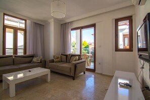 Apartment, Pool View | Living room | LCD TV, pay movies