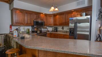 House, Multiple Beds, Fireplace | Private kitchen | Fridge, microwave, oven, stovetop