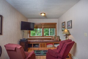 Apartment, 1 Queen Bed, Fireplace | Living room | TV, fireplace, DVD player - Cottage at Slope's Edge 1 Bedroom Apartment (McHenry)