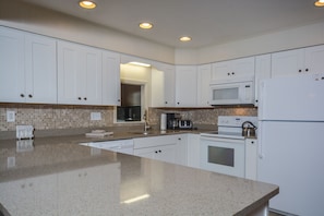 House, Multiple Beds, Hot Tub | Private kitchen | Fridge, microwave, oven, stovetop - At Ease 5 Bedroom House (Swanton)