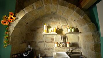 Full-sized fridge, stovetop, espresso maker, coffee/tea maker