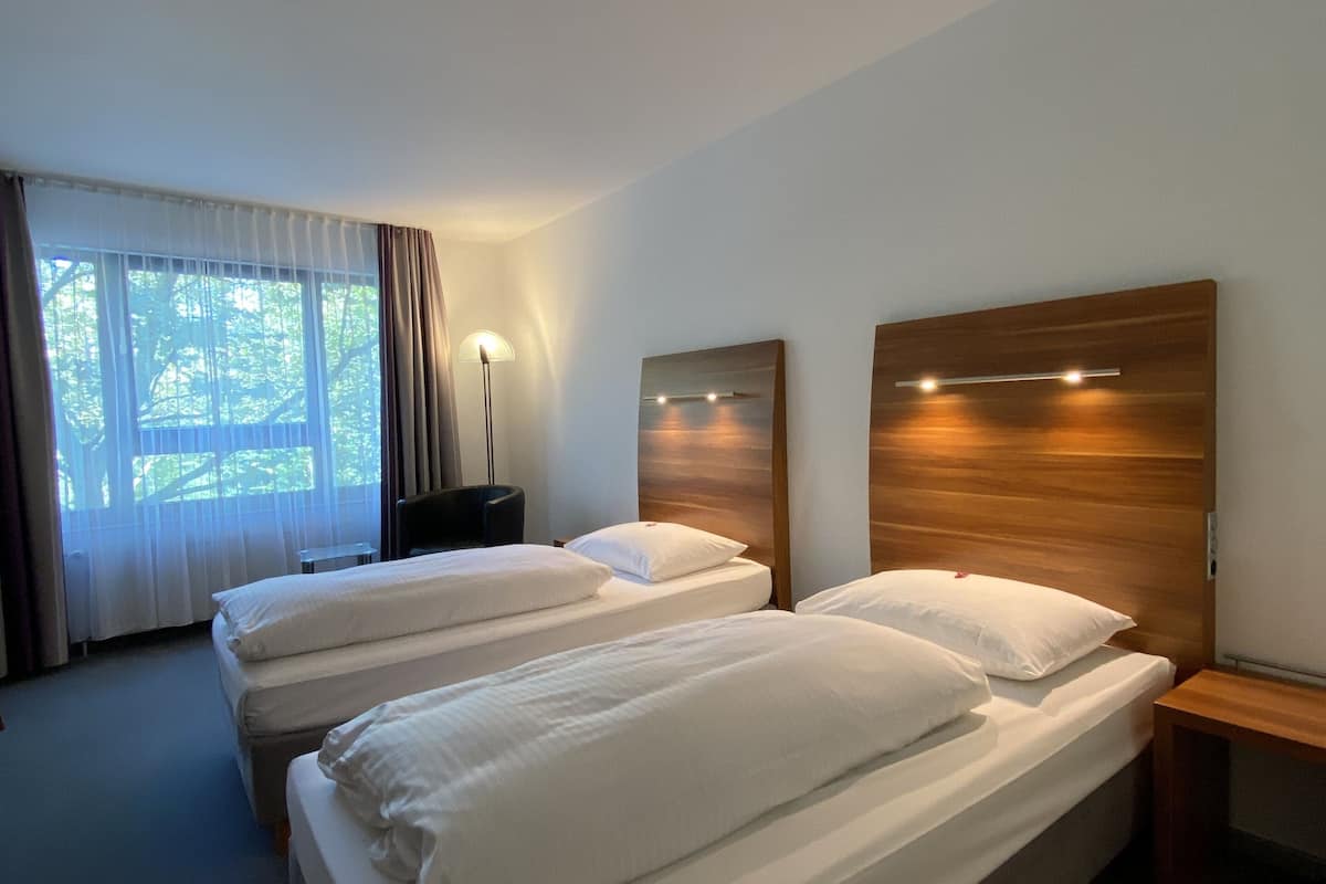 comfort double or twin room | in-room safe, desk, laptop workspace, iron/ironing board