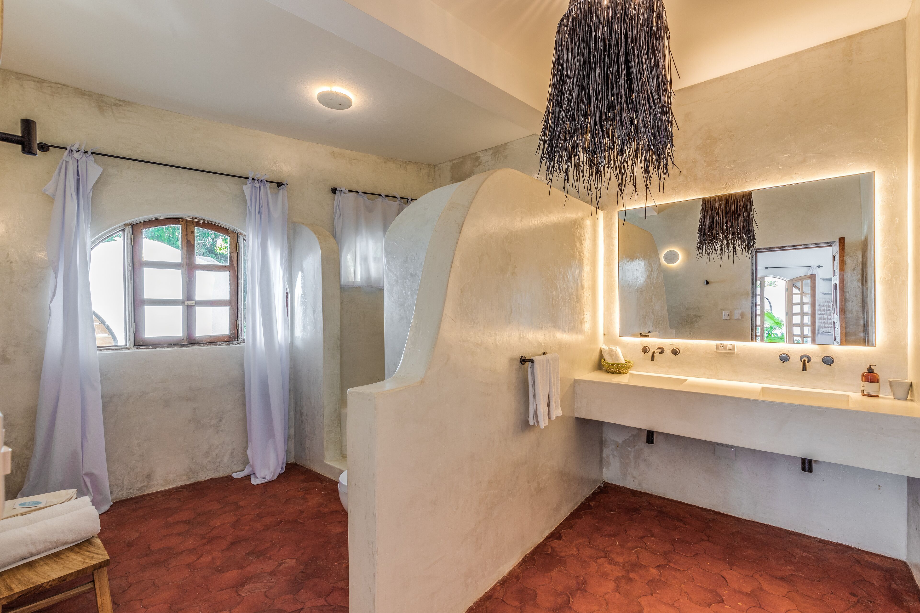 deluxe beachfront king suite with pool and sea view | bathroom | shower, free toiletries, hair dryer, towels