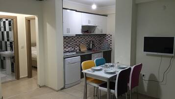 Apartment | Private kitchenette | Full-size fridge, microwave, stovetop, dishwasher