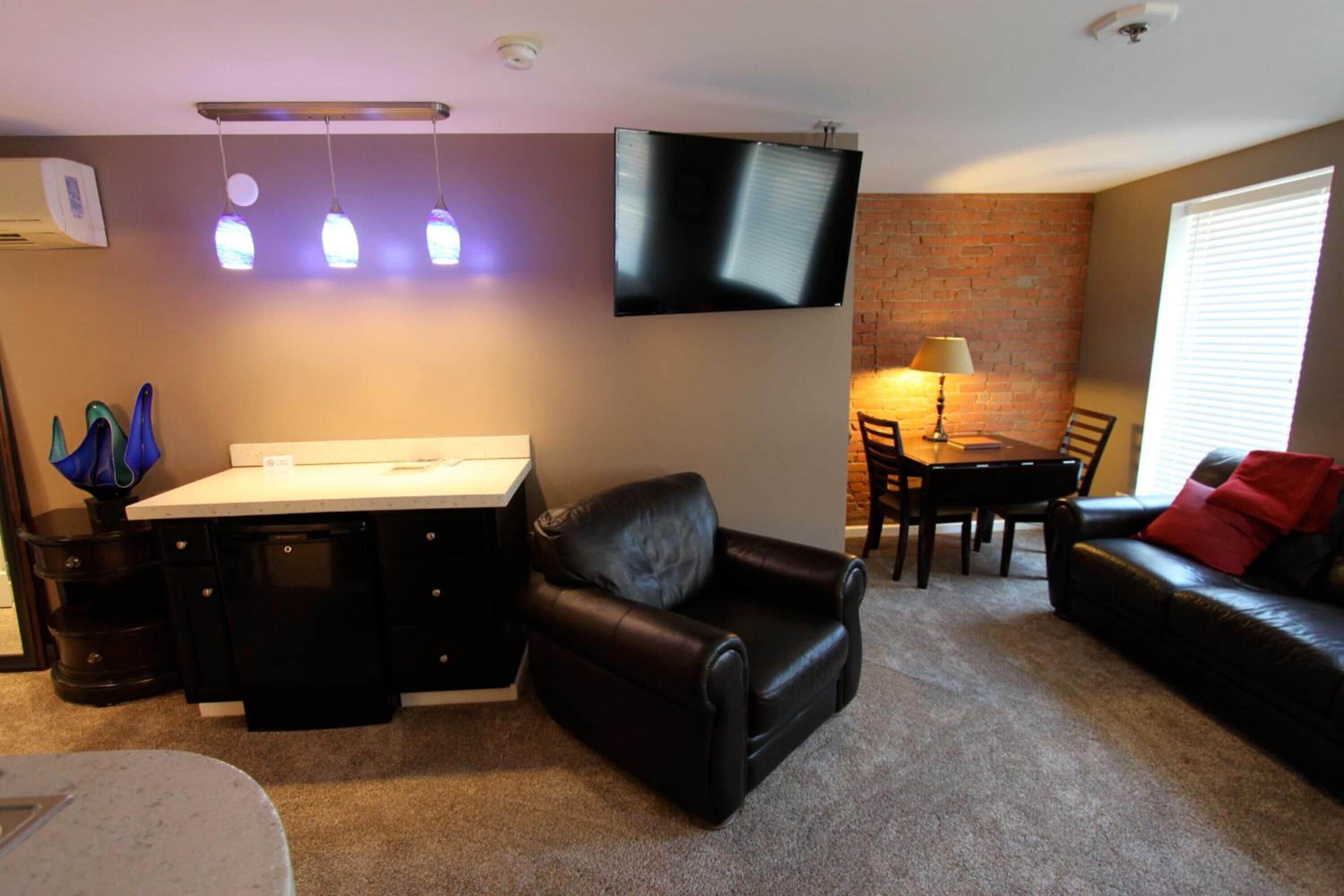 deluxe room, 1 king bed with sofa bed, non smoking, city view | living room | 50-inch smart tv with cable channels, tv, fireplace