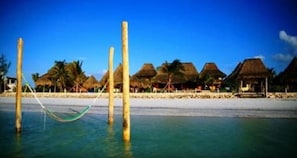Private beach, white sand, sun loungers, beach towels