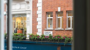 A brick building with a sign reading "D'Arblay Street, W1." - D'Arblay Street (London)