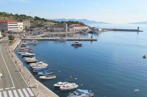 Stroll along the marina's paved walkway, offering easy access to the calm waters.