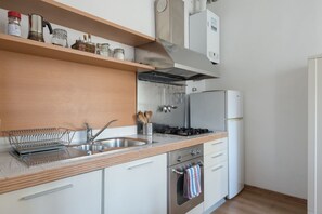 Fridge, stovetop, cookware/dishes/utensils