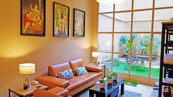 Comfort Apartment, Multiple Beds, Non Smoking, Garden View | Living area | LED TV, Netflix, DVD player, books