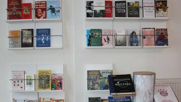 A book display with various titles and authors, including 'Harry Potter' and 'Wuthering Heights'.