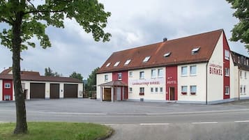 Landgasthof Birkel Hotel features a charming two-story facade with a central entrance and dormer windows.