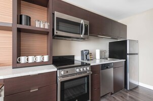 Suite, 1 Bedroom | Desk, blackout drapes, iron/ironing board, free cribs/infant beds