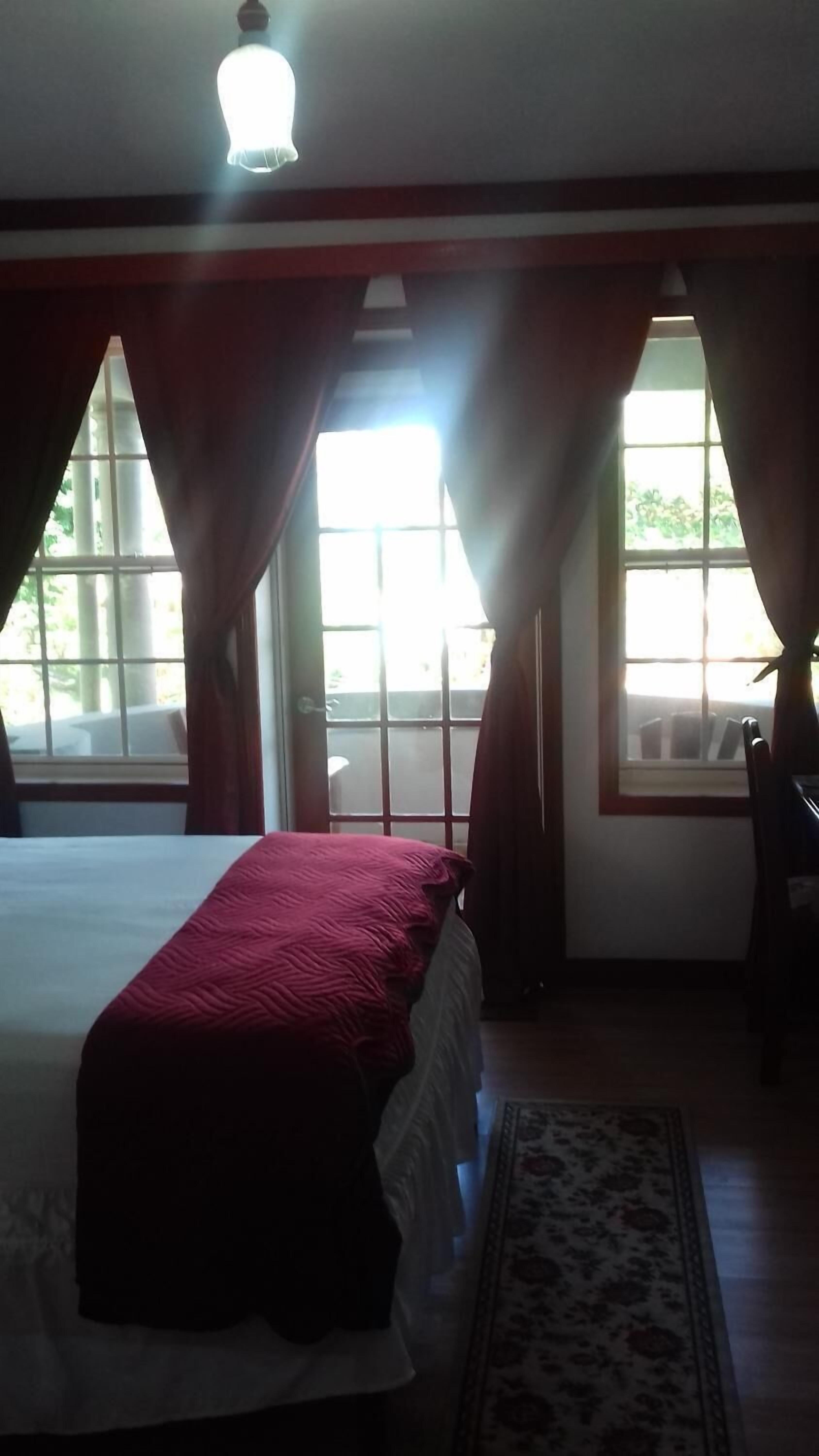 Premium bedding, desk, laptop workspace, iron/ironing board