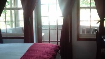 Premium bedding, desk, laptop workspace, iron/ironing board